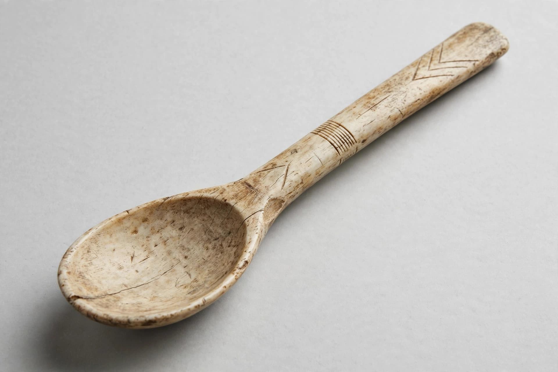 Inuit Carved Bone Spoon with Incised Decoration — Primary view
