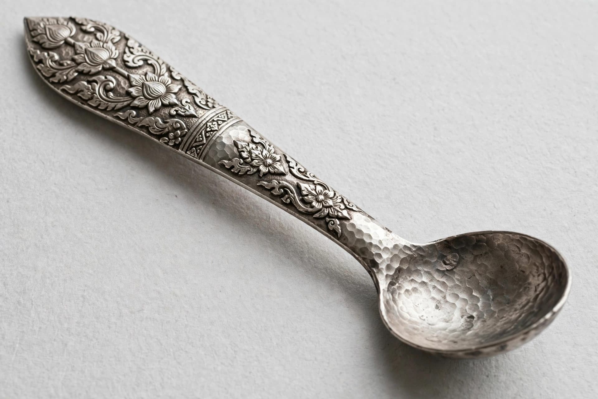 Thai Repoussé Silver Spoon with Floral Scrollwork — Primary view