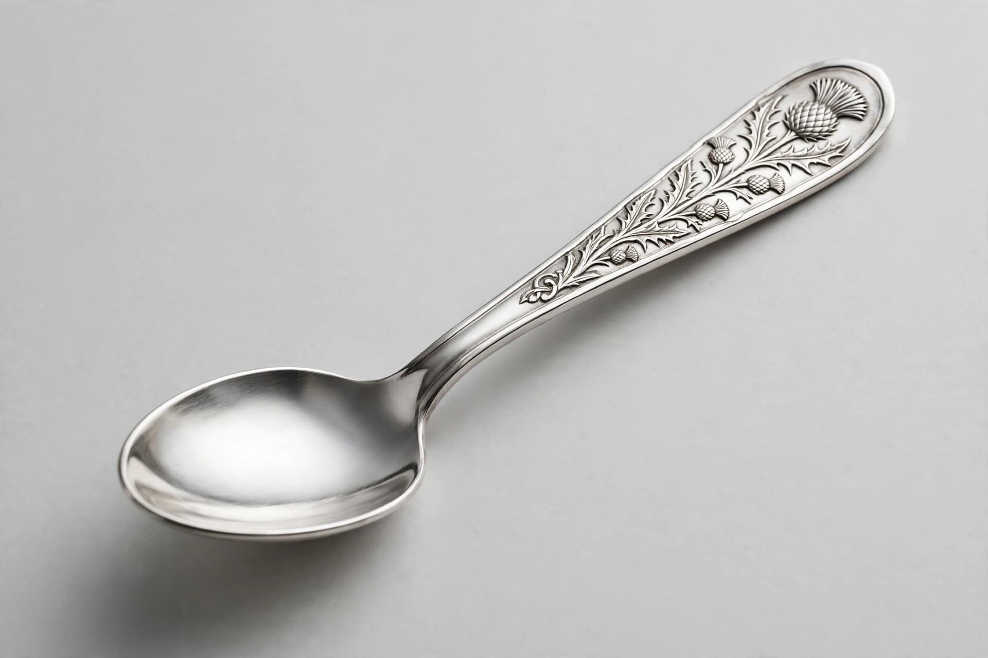 Scottish Silver Teaspoon with Thistle Engraving — Primary view