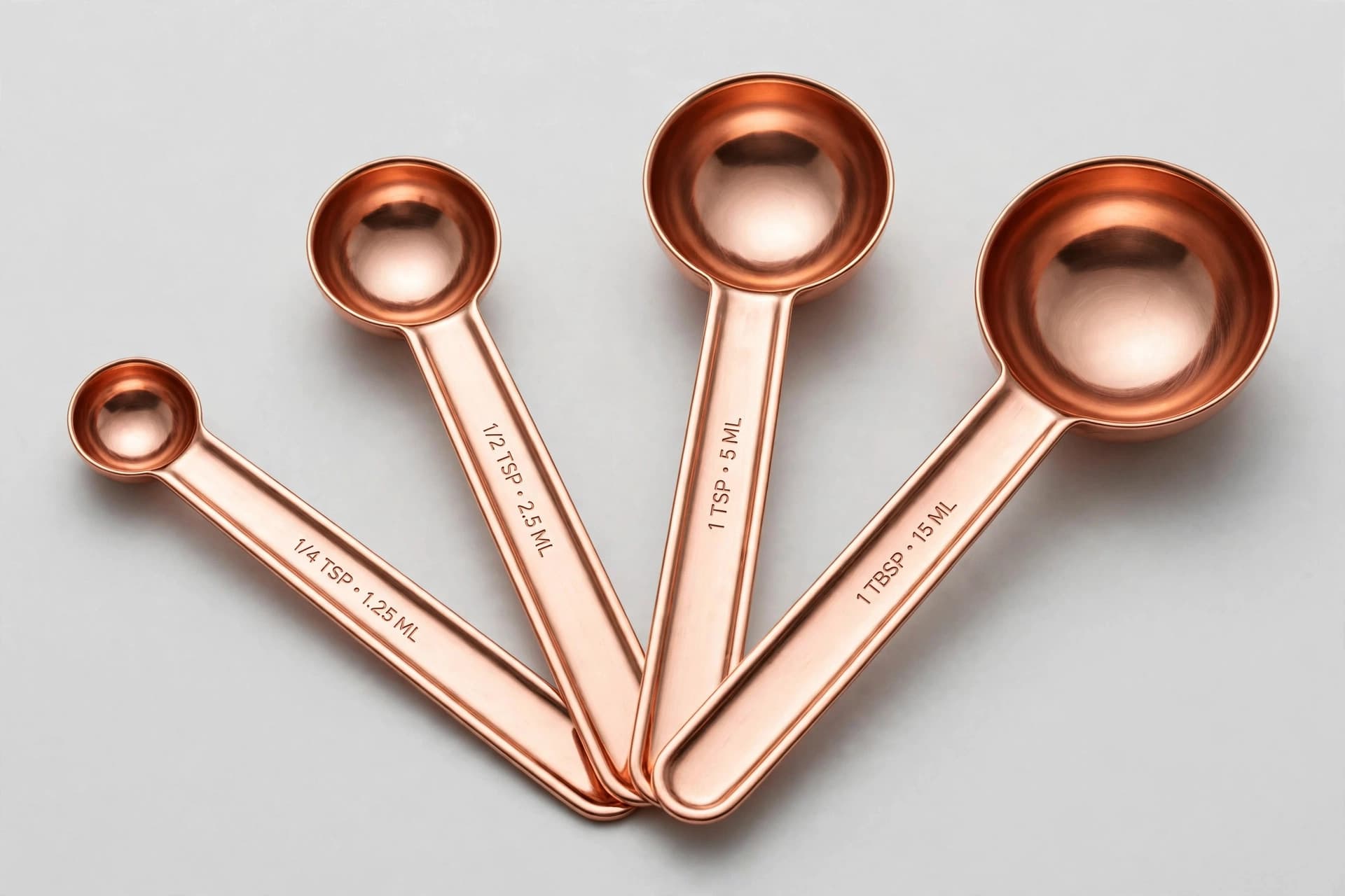 Set of Four Copper Measuring Spoons, Contemporary — Primary view